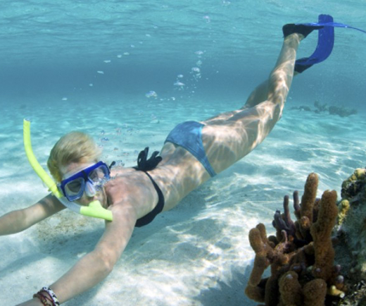 Woman snorkeling at the beach on St. John