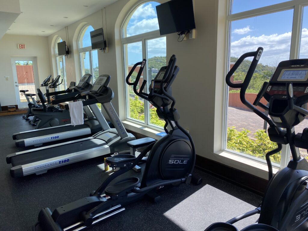 Treadmills, elliptical machines, and fitness bikes available in the fitness center provided by The Hills St John.