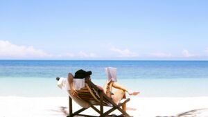 A woman relaxing while reading a book on a St. John USVI beach