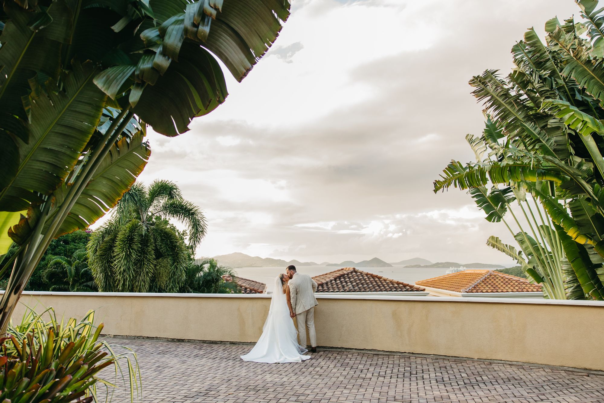 Bride walking the villa terrace overlooking the Caribbean at The Hills St. John