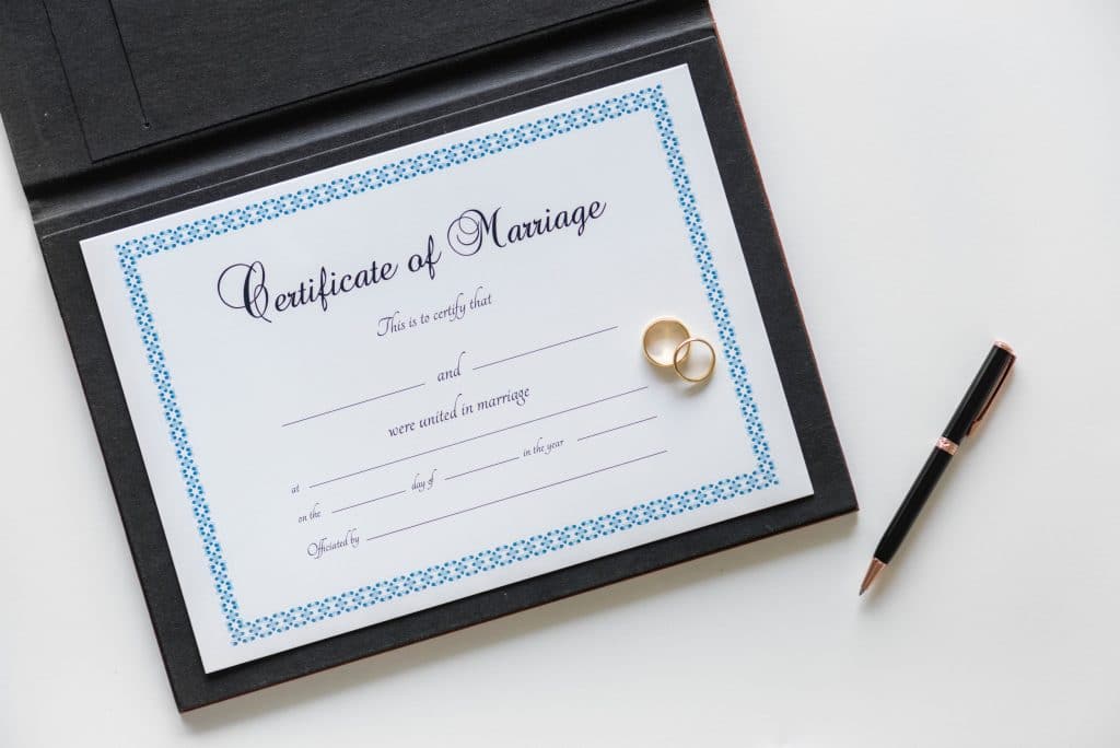 Close-up of marriage license documents and paperwork