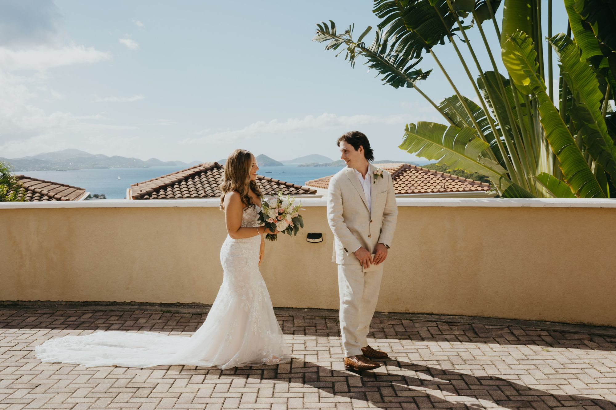 Bride and groom first look on a villa walkway at The Hills St. John